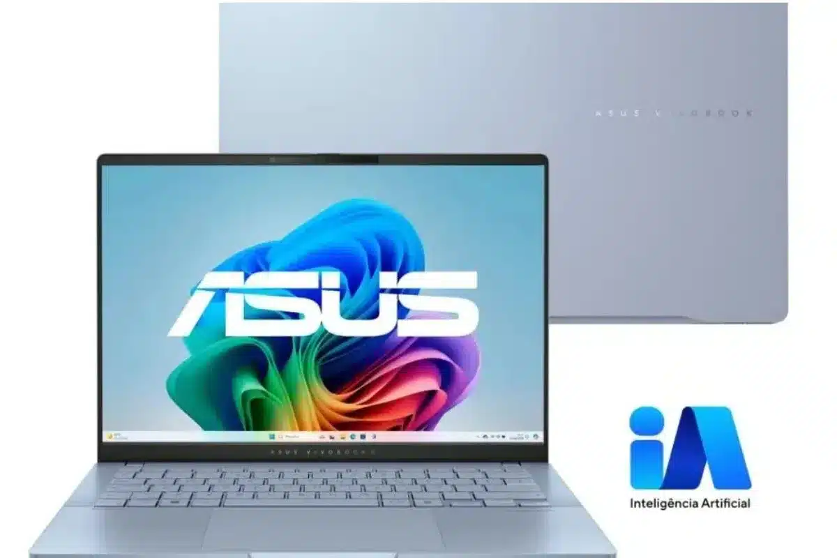 ASUS Zenbook S 14 aberto, visto de frente, com acabamento prateado, tela exibindo imagem colorida do Windows e destaque para recursos de inteligência artificial.